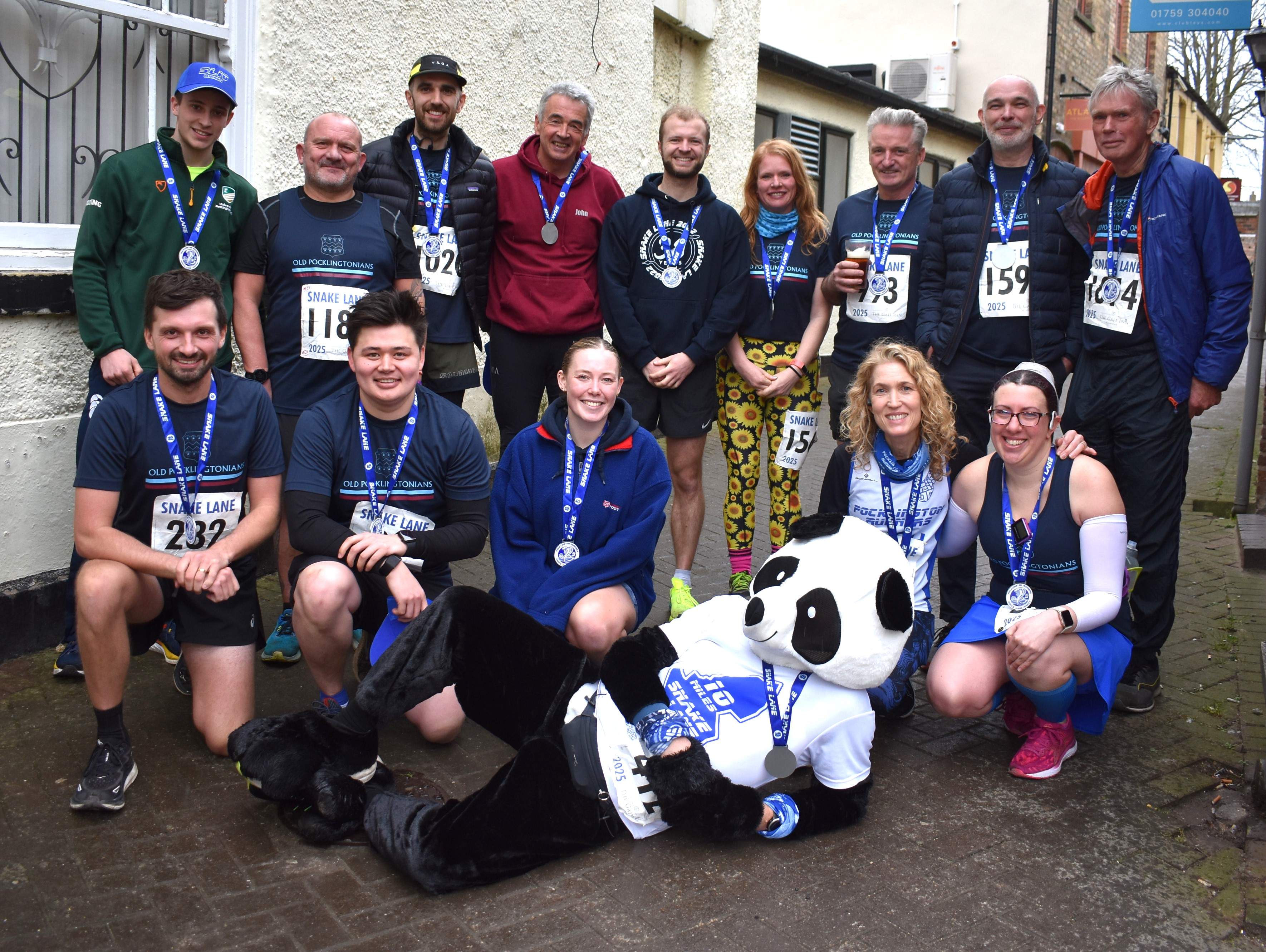 Members of the 2025 OP Snake Lane team, outside The Feathers Hotel in Pocklington after the race