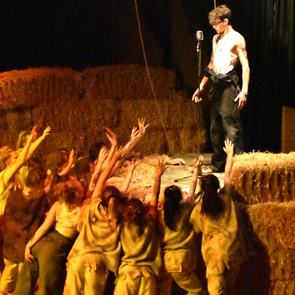 Cast members during a performance of Animal Farm