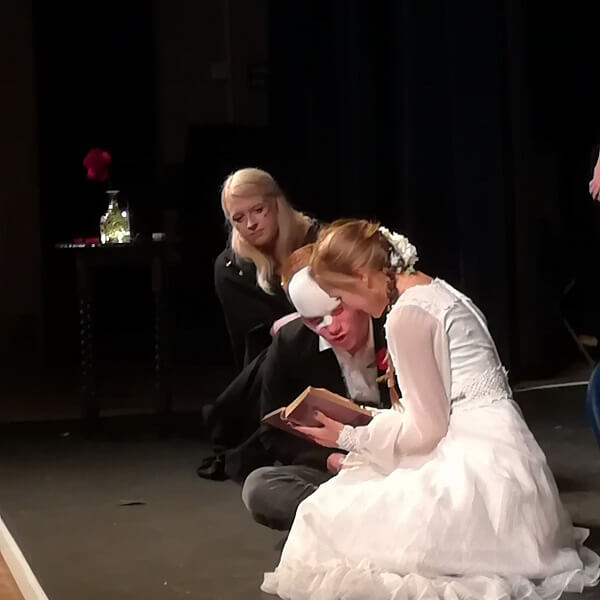 The students performing a scene from Beauty and the Beast