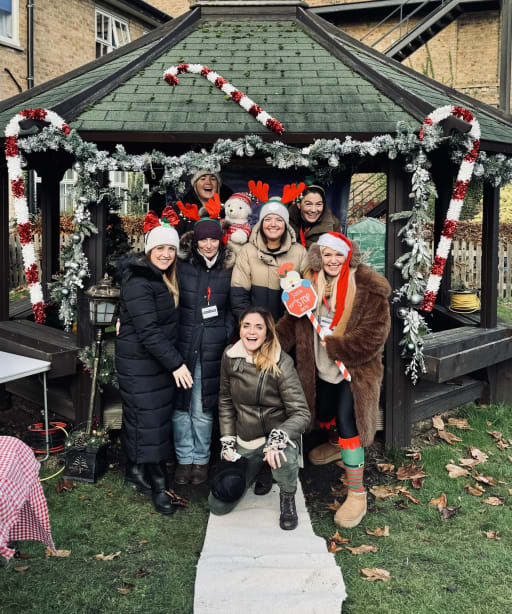 Members of Friends of Pocklington Prep School stood outside, in front of a Christmas decorated gazebo at the Christmas Fayre