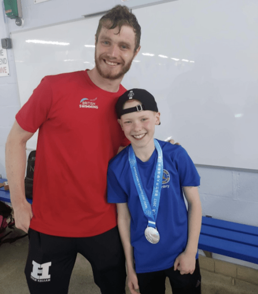 photograph of Jay Elliot with a participant from Stokerite swim school