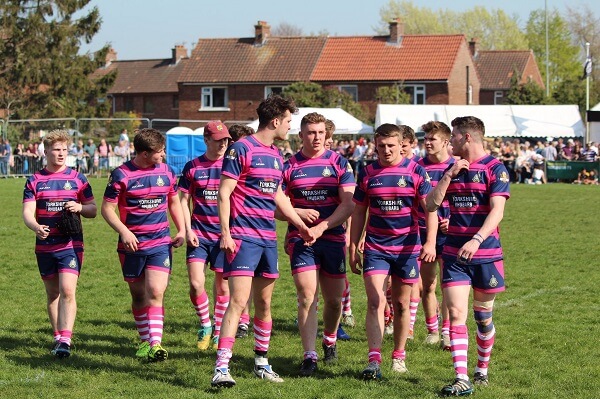 OP Dragons Pock 7s Rugby team walk off the pitch after a match at Pocklington Town Rugby Club