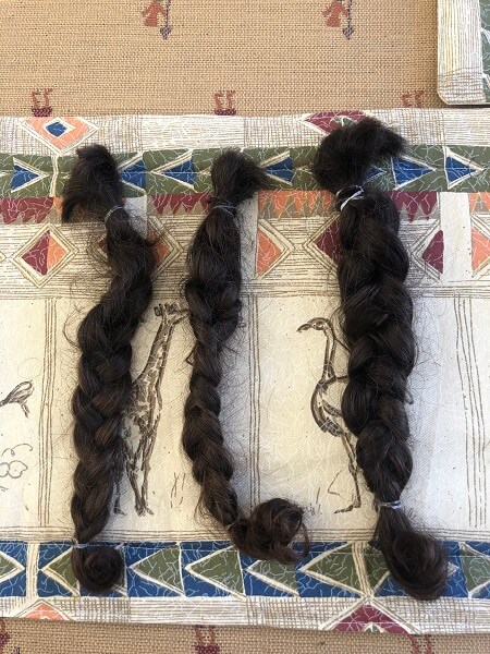 Sean's hair braided into pigtails ready for donation to the little princess charity