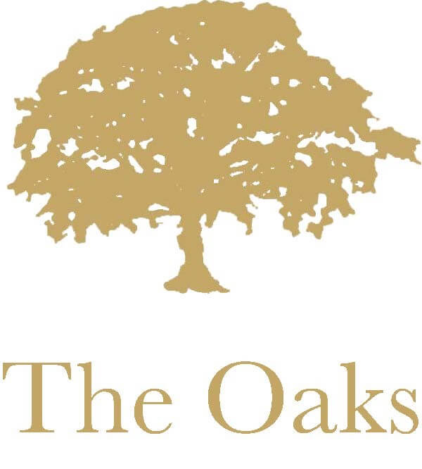 Outline of brown tree above the words 'The Oaks' - logo for The Oaks Golf Club