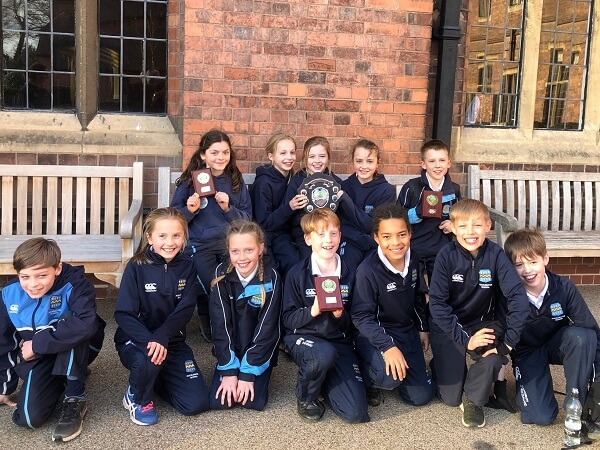 Pocklington Peep School Cross Country team proudly hold their winning trophies