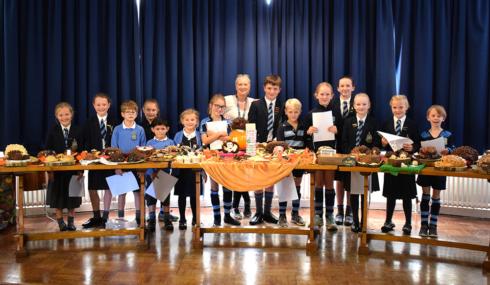 Pocklington Prep School pupils with staff bake off cakes