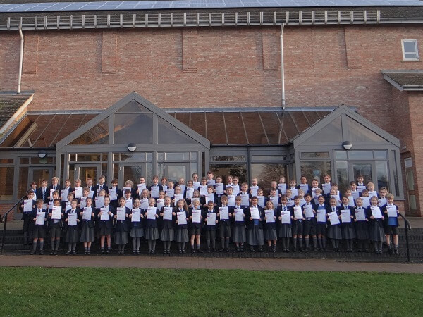 Pocklington Prep School pupils hold thier LAMDA certificates outside the Tom Stoppard Theatre