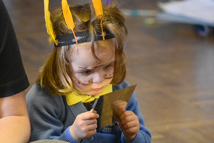 Pocklington Pre-Prep Pupil looks at her facepainting in a mirror