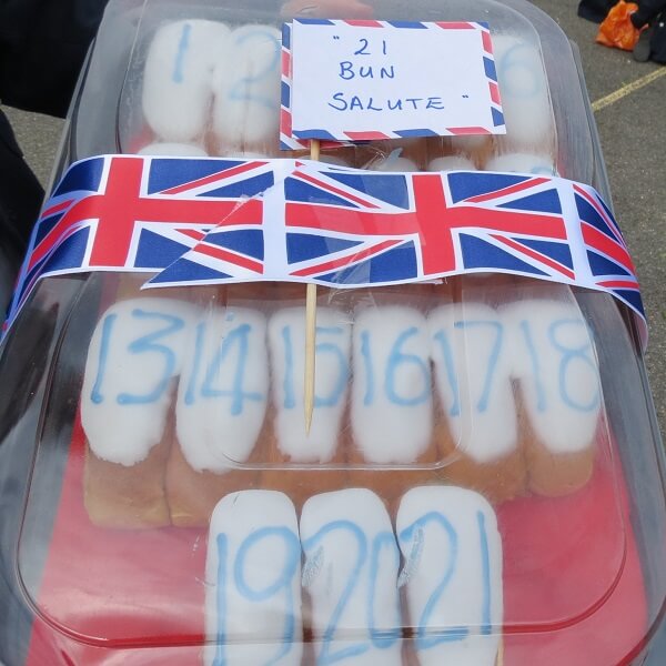 21 numbered buns in a box, decorated with union jack ribbon to form the '21 bun salute'