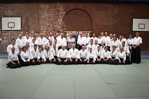 Aikido enthusiasts with Pocklington School Domestic Bursar and staff in the Sports Hall at Pocklington School