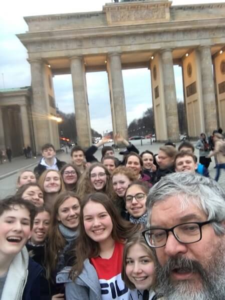 Pupils studying German from Pocklington School stood  by the Brandenburg Gate in Berlin