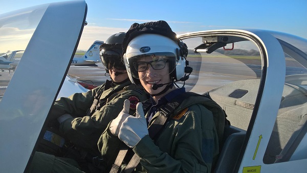 Pocklington School CCF RAF cadet receiving instruction in a tutor aircraft at RAF Topcliffe