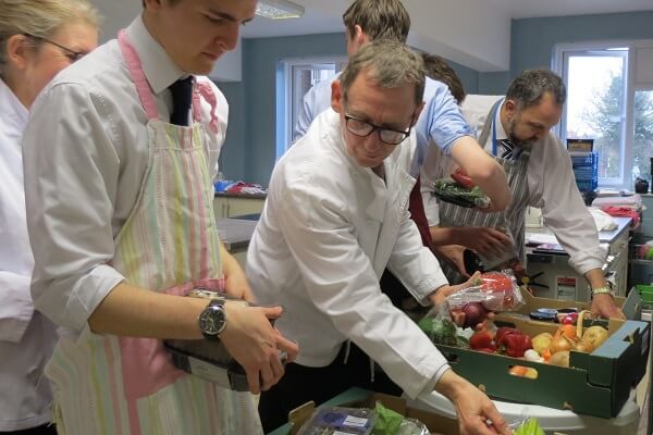 Students, staff and Tesco supermarket representatives choose their cooking ingredients from the short dated food