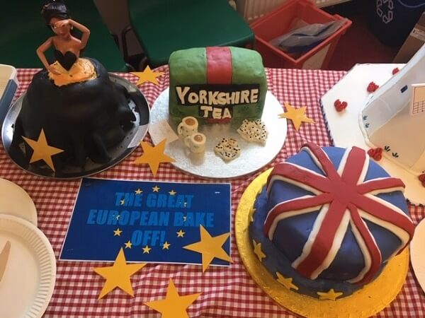 European themed cakes on a red and white gingham tablecloth