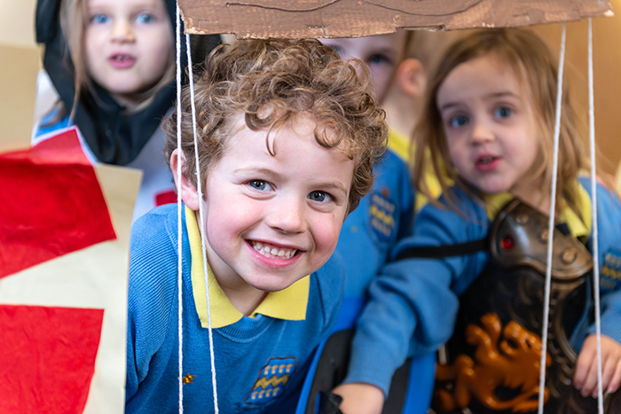 Pocklington Pre-Prep boy playing inside smiling with friends