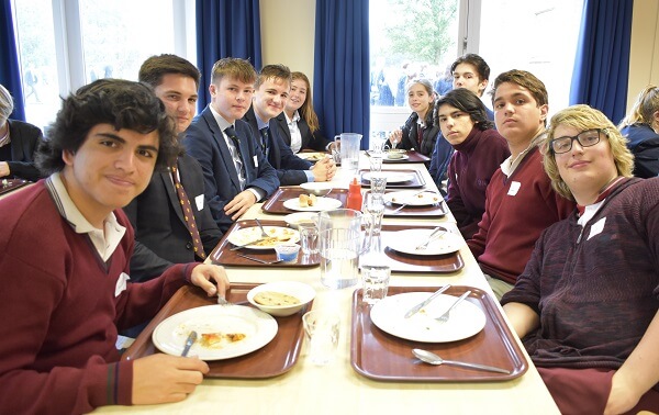 Argentinian and Pocklington pupils eat lunch together in the school dining hall