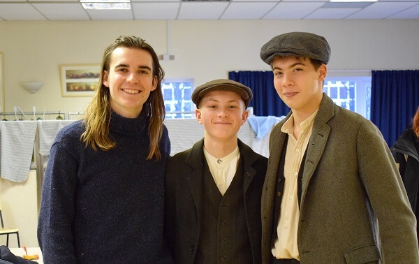 Former pupil George Jibson with two Pocklington School pupils who were cast in the filming of 'Hellfighters' on location at Pocklington School