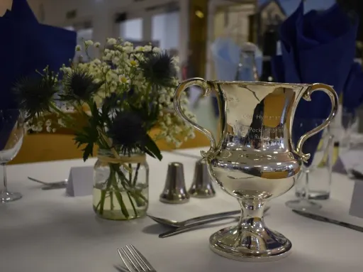 Lunchoen place setting with the Presidents' Cup in view