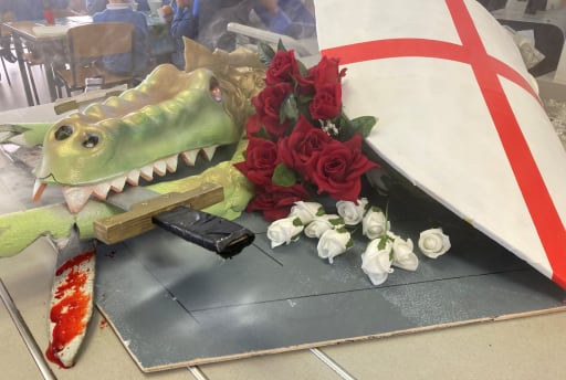 model of a dragon, sword,  St George's flag and red and white roses