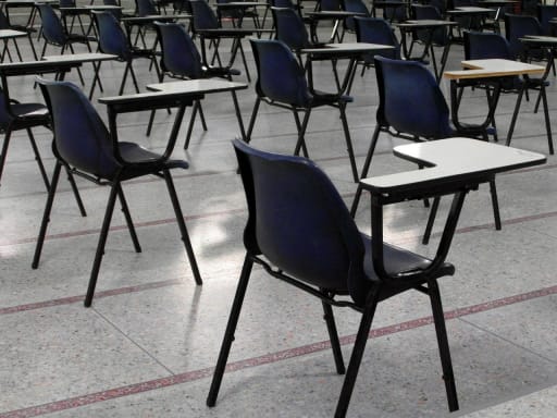 Empty desks in exam hall