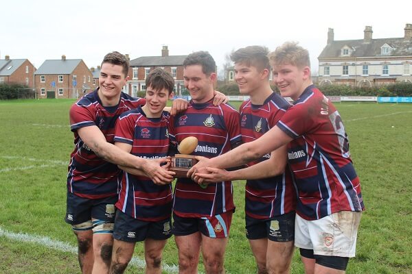 Members of the OP team, holding the Bottomley Trophy at the Town v Gown match held at Pocklington RUFC