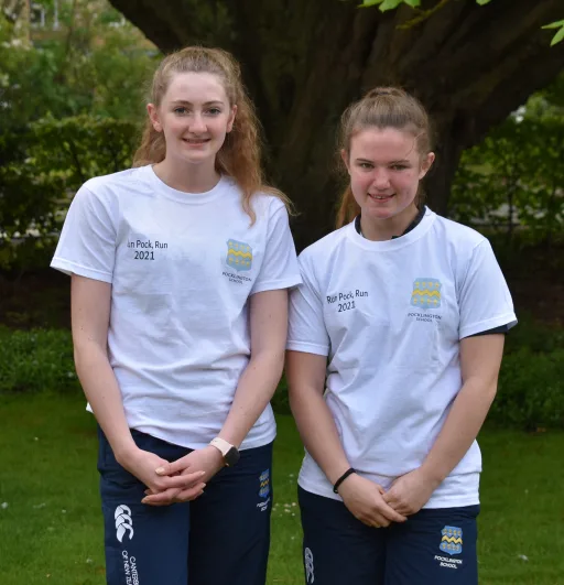 Two Pocklington School girls wearing Run Pock Run branded white T-shirts