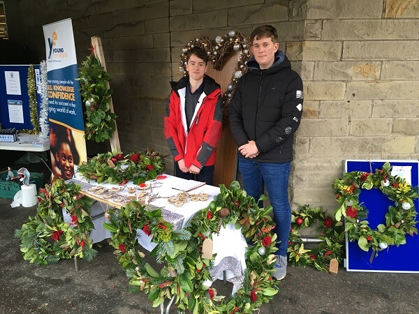 Pocklington School team members at their trade stand at a Young Enterprise Event in Harrogate