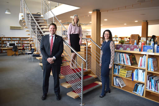 The Headmaster and 2 members of Pocklington School staff stand in the school Library