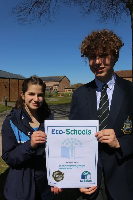 Girl and boy holding Eco -Schools bronze award certificate at Pocklington School