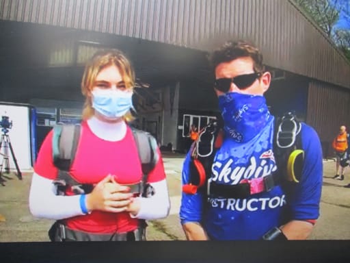 Phoebe and instructor before the tandem skydive at Yorkshire's Parachute Club before the 